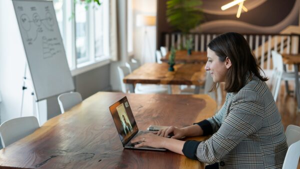 Image of a woman on a virtual meeting- Role of a Fractional CFO in Your Business Accounting blog featured image